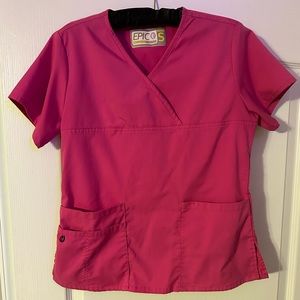 Bright pink scrub top in a size small.
